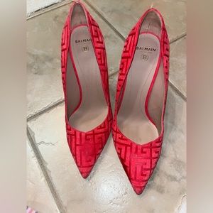 Balmain jacquard printed logo pumps. Suede. Color on box says “Ruby” Gold heel